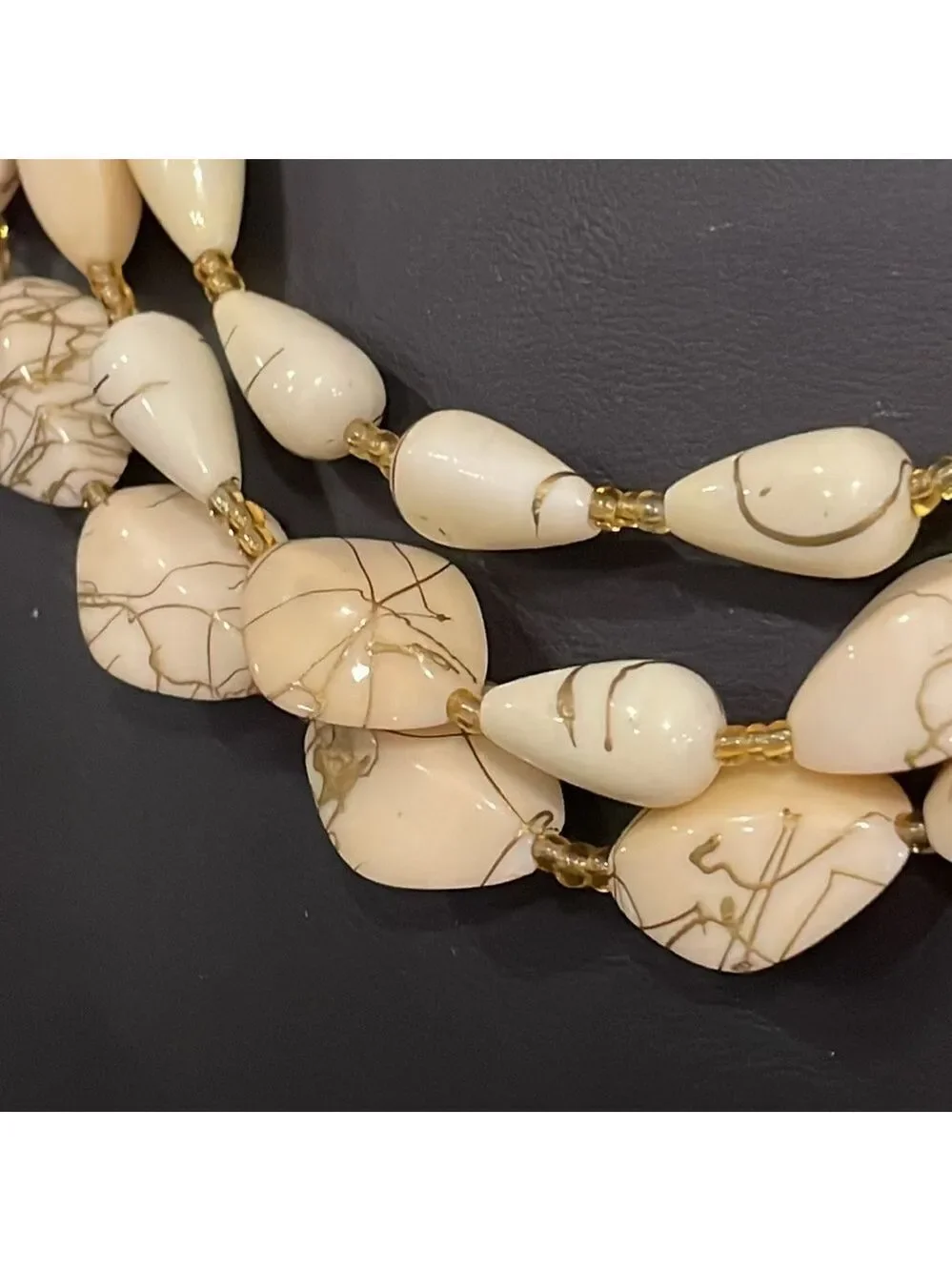 Vintage triple strand gold seed bead and ivory swirl beaded necklace